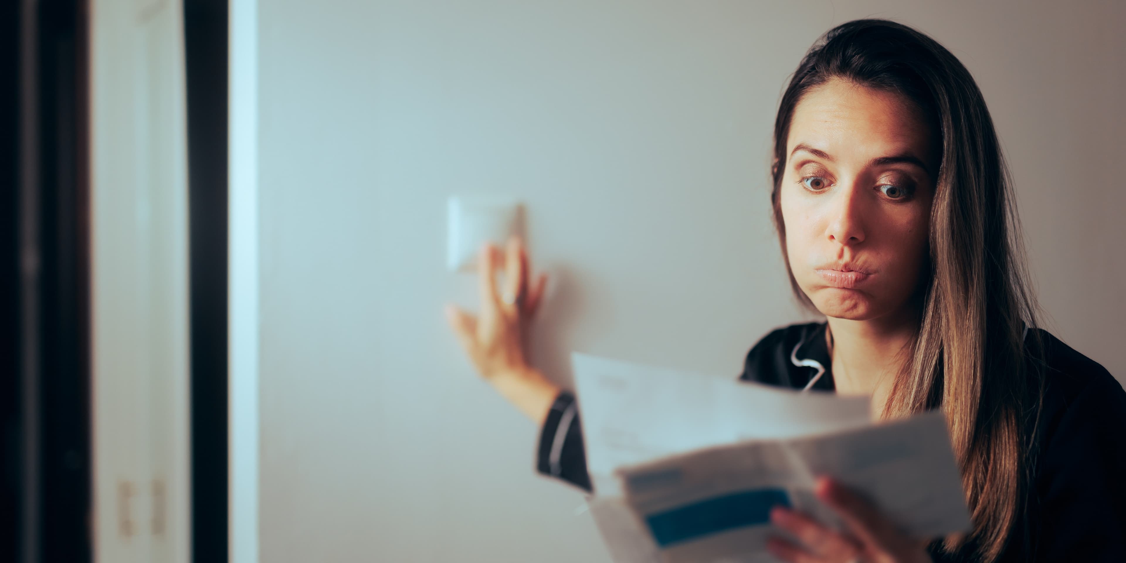 Woman Checking Electricity Bill