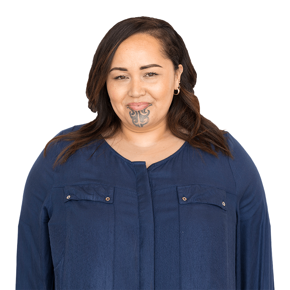 Happy woman with ta moko in blue shirt.